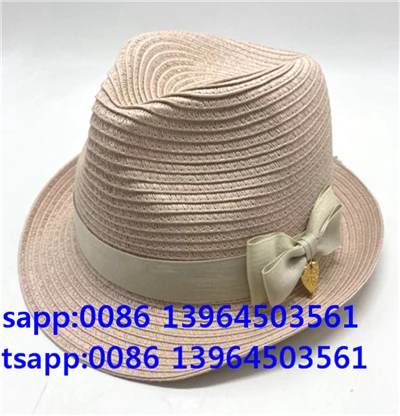 Mujeres de color rosa claro papel paja fedora gorro de sol